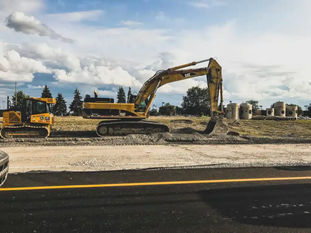 excavator working on asphalt